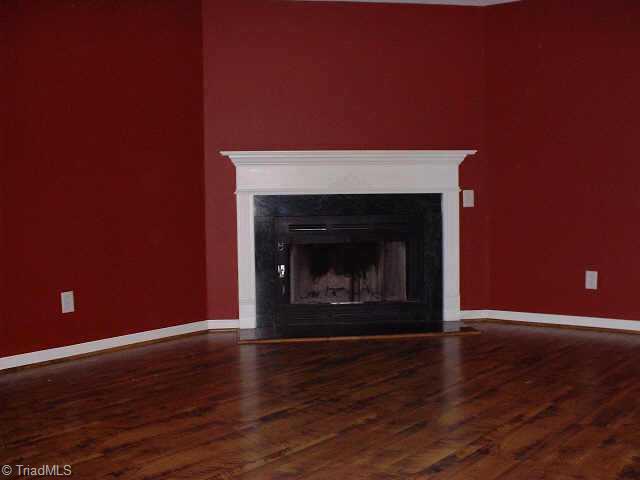 1662 Riverview Road Walnut Cove, NC 27052 - Photo 5 of 7 Other. Living Room w/wood floor & woodburning FP