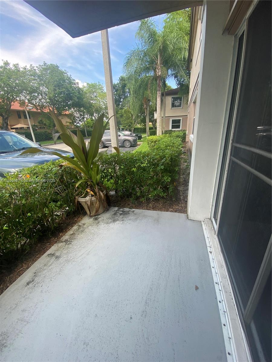 11232 Southwest 12th Street, Unit 101 Pembroke Pines, FL 33025 - Photo 18 of 37 a view of a garden from a windows