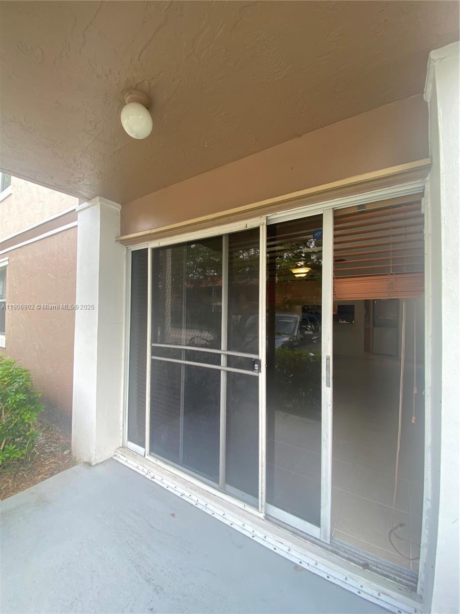 11232 Southwest 12th Street, Unit 101 Pembroke Pines, FL 33025 - Photo 19 of 37 a view of an empty room with a window