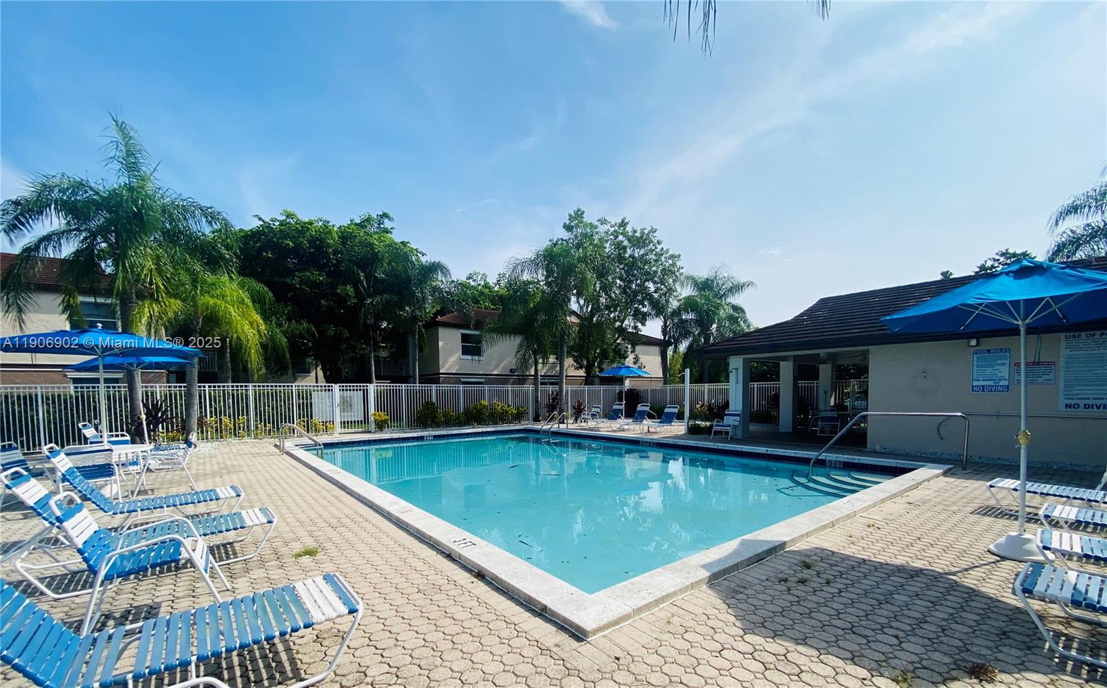 11232 Southwest 12th Street, Unit 101 Pembroke Pines, FL 33025 - Photo 36 of 37 a view of swimming pool with chairs
