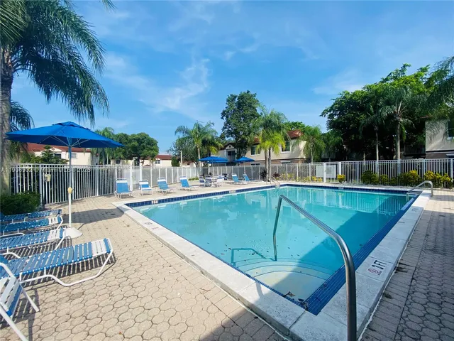 a view of a swimming pool with a patio