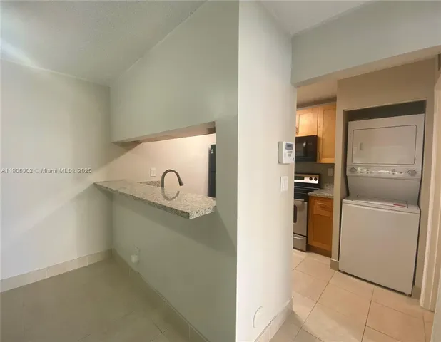 a view of a kitchen with a sink