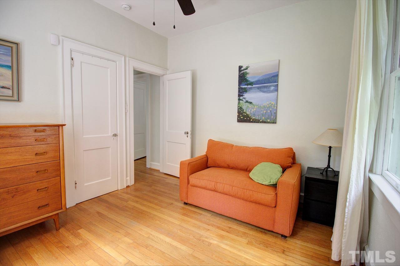 500 Harvey Street Raleigh, NC 27608 - Photo 22 of 26 a living room with furniture and a dresser