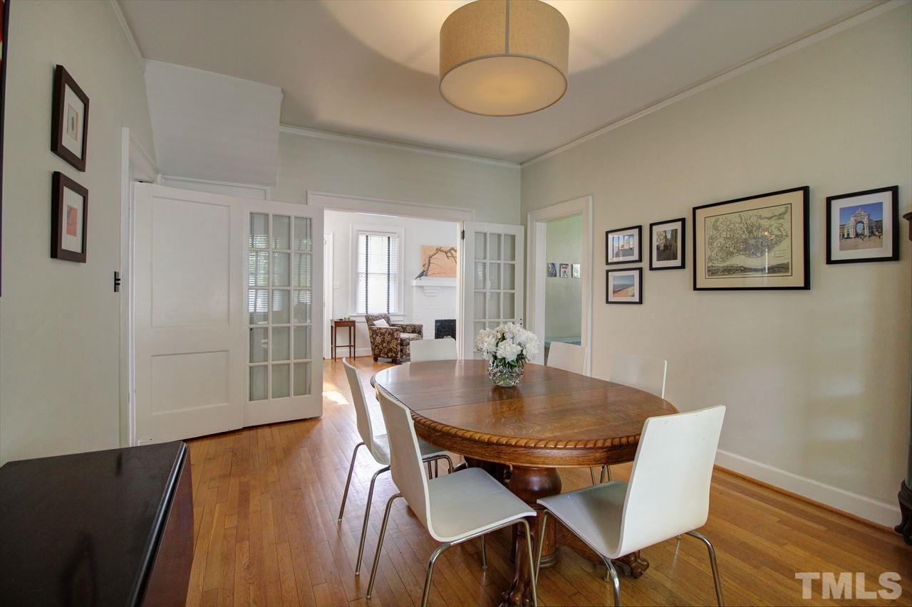 500 Harvey Street Raleigh, NC 27608 - Photo 9 of 26 a view of a dining room with furniture and wooden floor