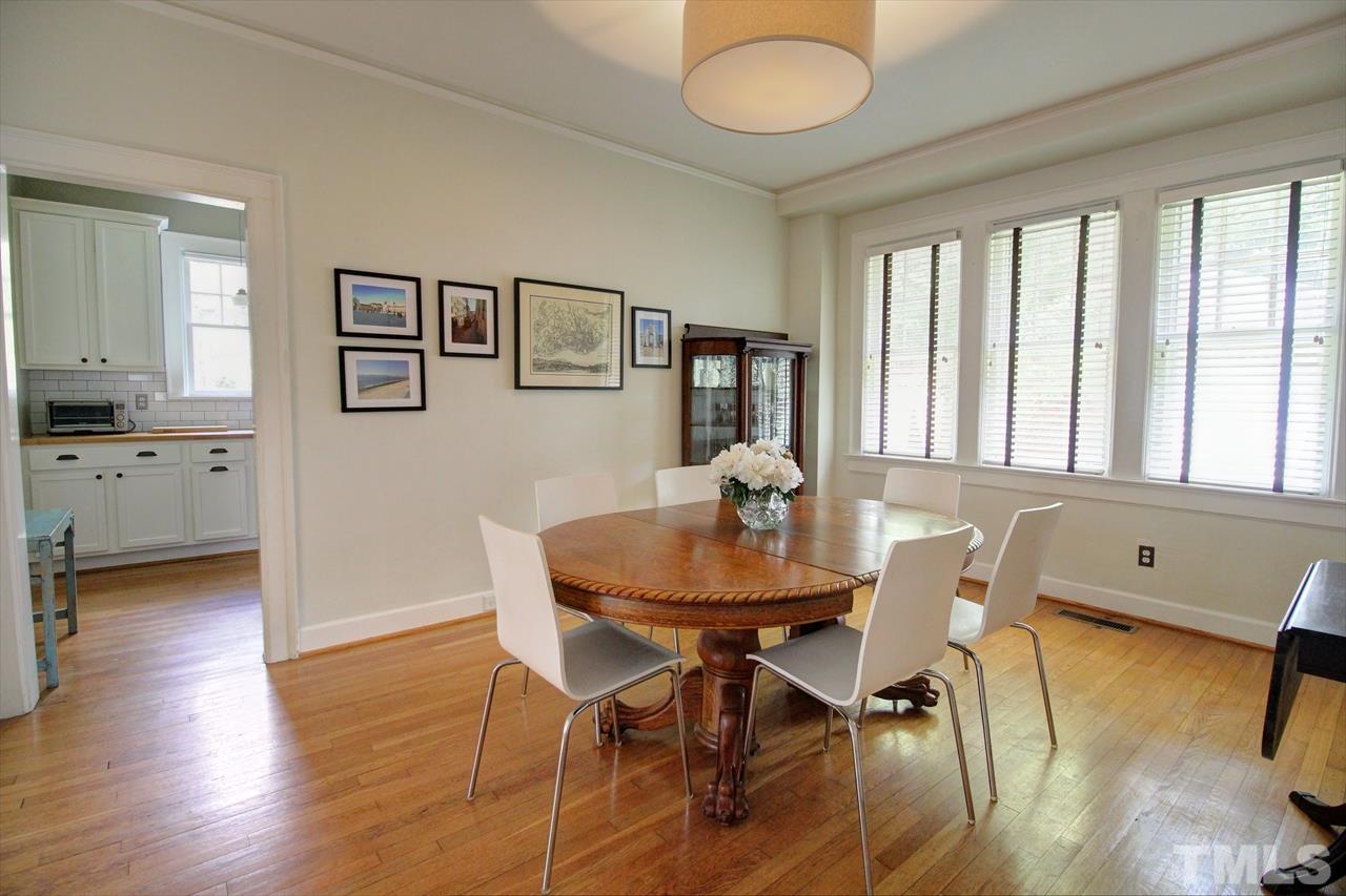 500 Harvey Street Raleigh, NC 27608 - Photo 10 of 26 a view of a dining room with furniture and wooden floor