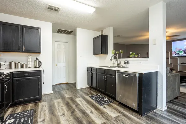 a spacious bathroom with a sink double vanity and a mirror