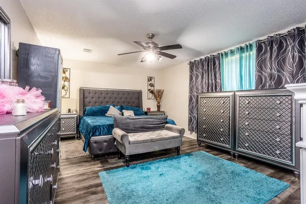 a bedroom with furniture and a fireplace