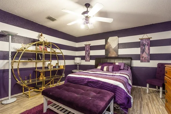 a bed room with a bed and a chandelier