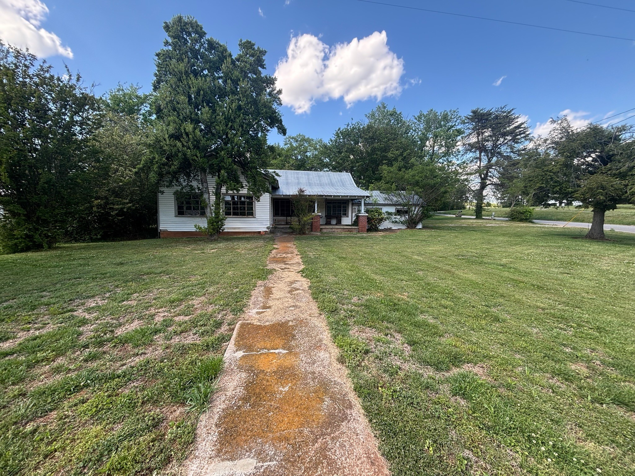 1687 Georgia Crossing Road Winchester, TN 37398 - Photo 26 of 38 a front view of a house with a yard and trees