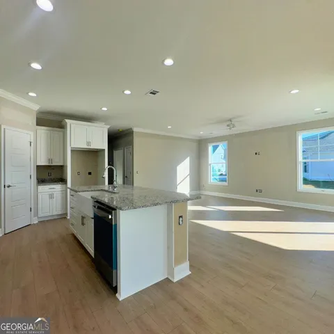 an empty room with wooden floor