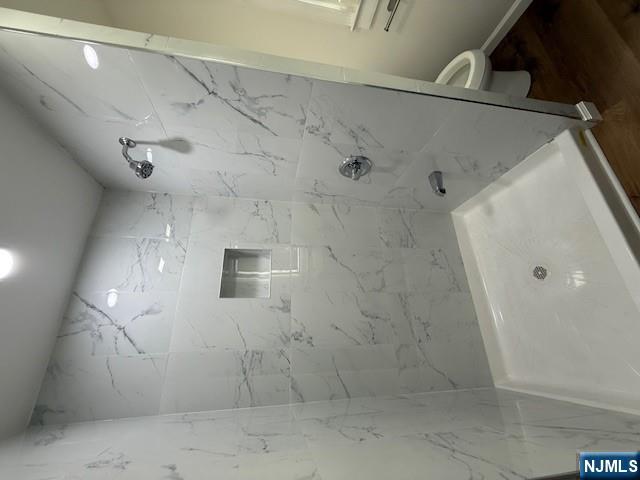 16 Central, Unit 2 Bergenfield, NJ 07621 - Photo 12 of 32 a bathroom with a shower and a toilet
