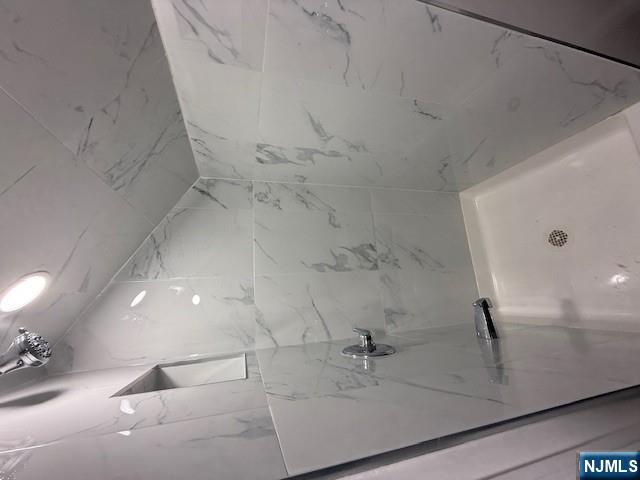 16 Central, Unit 2 Bergenfield, NJ 07621 - Photo 20 of 32 a bathroom with a bathtub