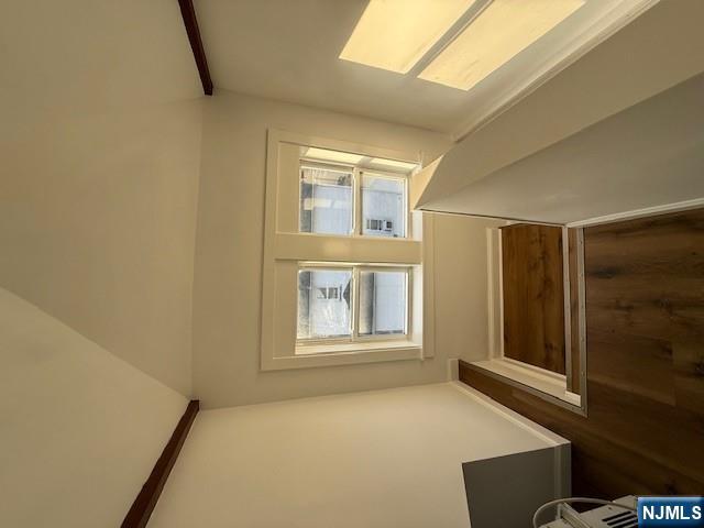 16 Central, Unit 2 Bergenfield, NJ 07621 - Photo 25 of 32 a room with furniture and a window