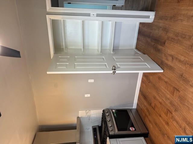 16 Central, Unit 2 Bergenfield, NJ 07621 - Photo 5 of 32 a view of a kitchen with a sink and a stove top oven