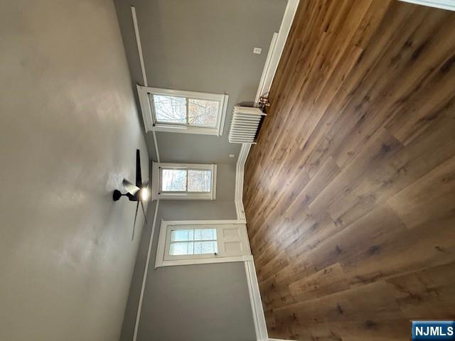 16 Central, Unit 2 Bergenfield, NJ 07621 - Photo 10 of 32 an empty room with wooden floor and windows