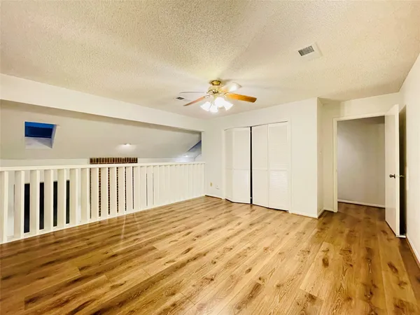 a bathroom with a granite countertop sink mirror and cabinets