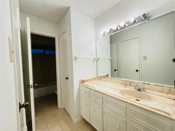 a bathroom with a toilet and a bathtub