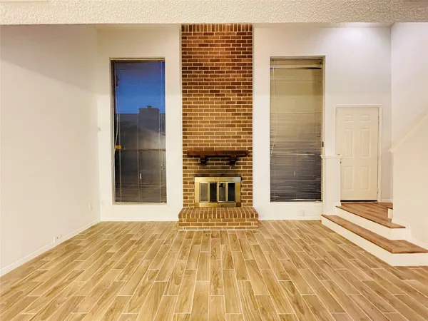 a view of a entryway with wooden floor