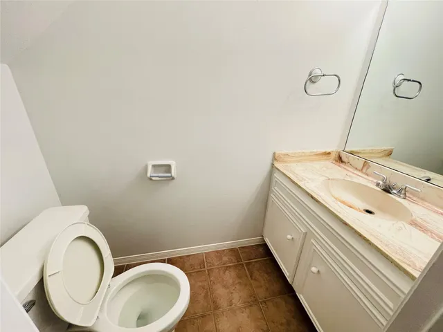 a view of a bedroom with wooden floor
