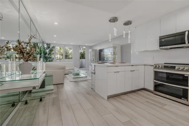 a view of a swimming pool with outdoor seating