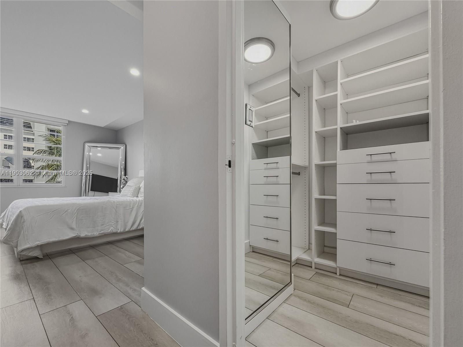 100 Lincoln Road, Unit 323 Miami Beach, FL 33139 - Photo 13 of 59 a view of bedroom with furniture and window