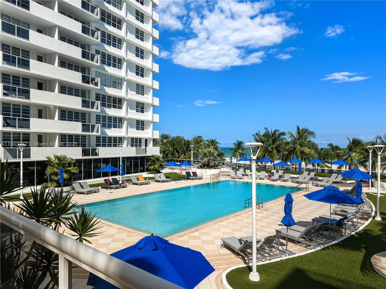 100 Lincoln Road, Unit 323 Miami Beach, FL 33139 - Photo 14 of 59 a view of a swimming pool with outdoor seating