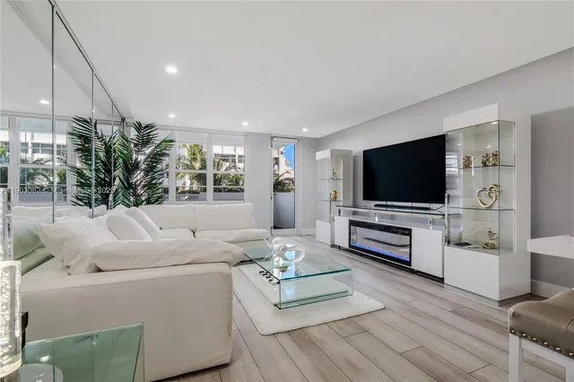 a bathroom with a granite countertop sink a toilet and bathtub