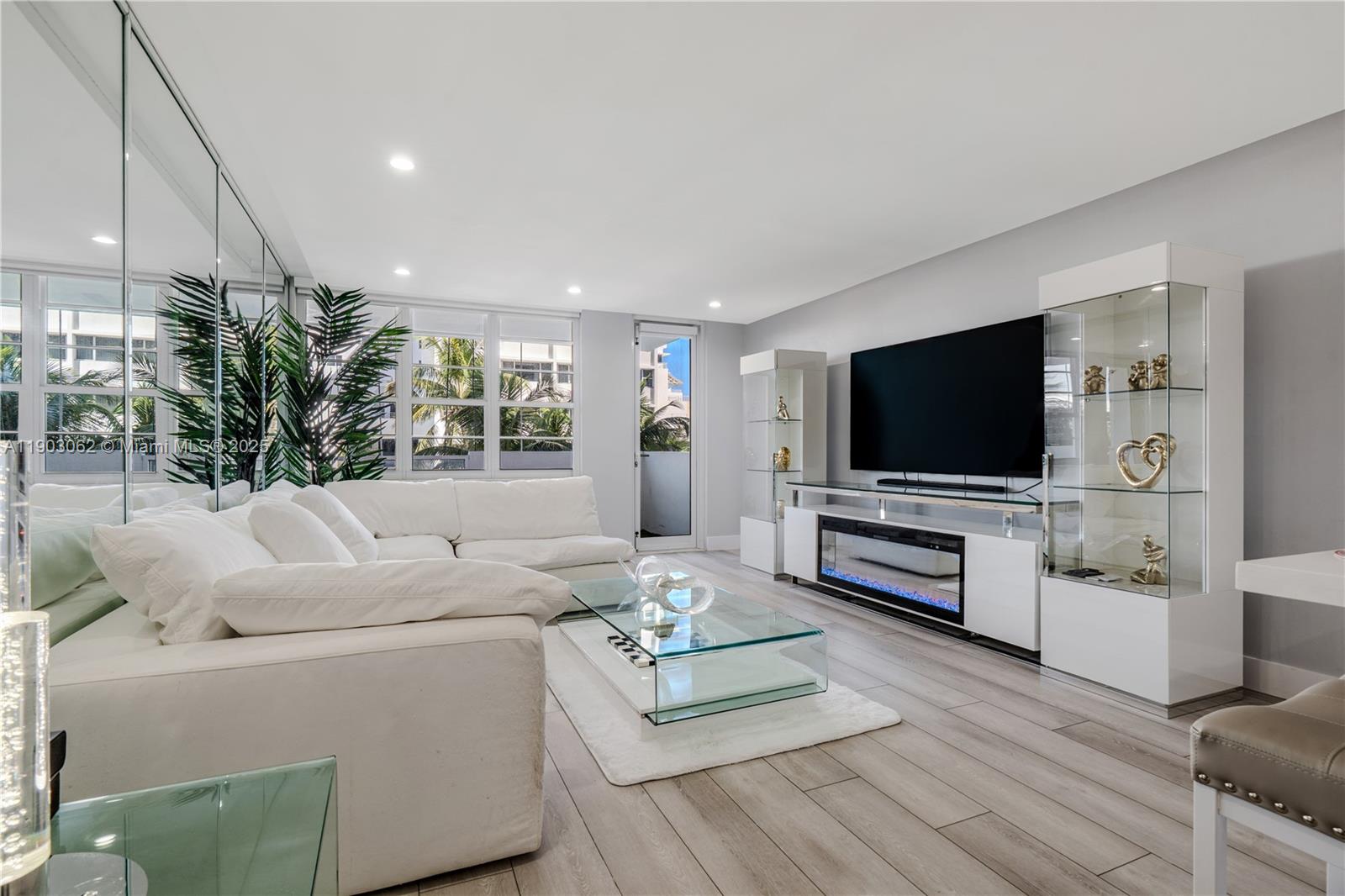 100 Lincoln Road, Unit 323 Miami Beach, FL 33139 - Photo 16 of 59 a living room with furniture and a flat screen tv