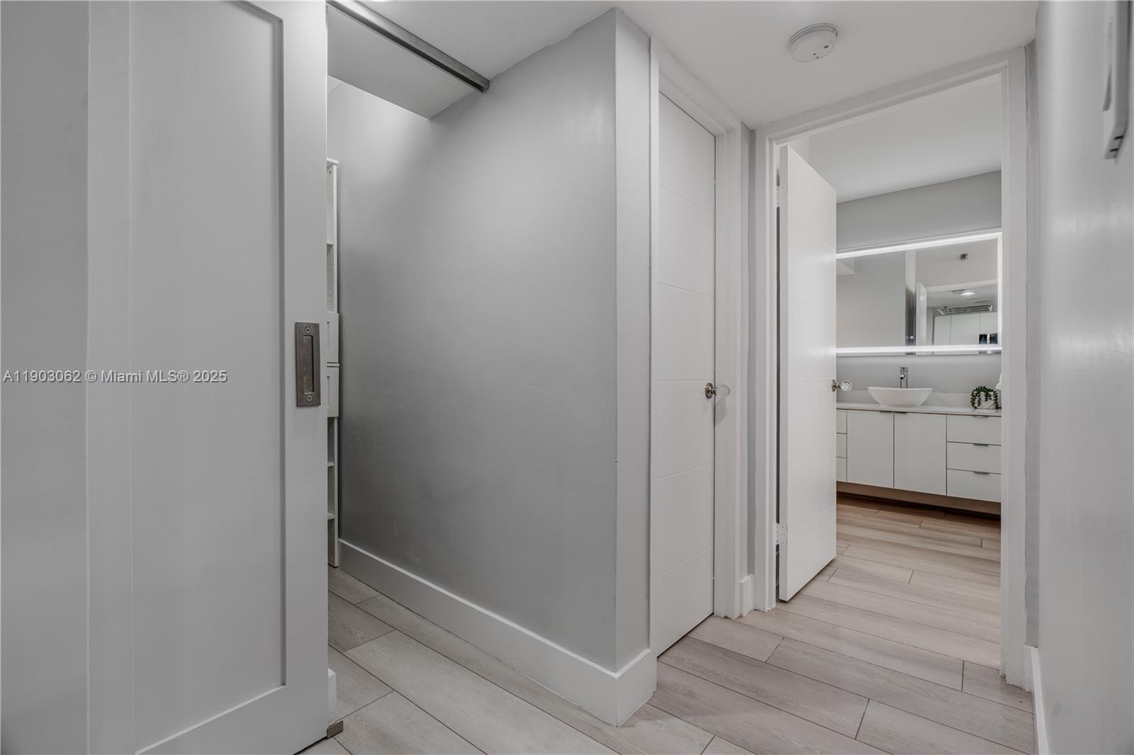 100 Lincoln Road, Unit 323 Miami Beach, FL 33139 - Photo 26 of 59 a bathroom with a double vanity sink and a mirror