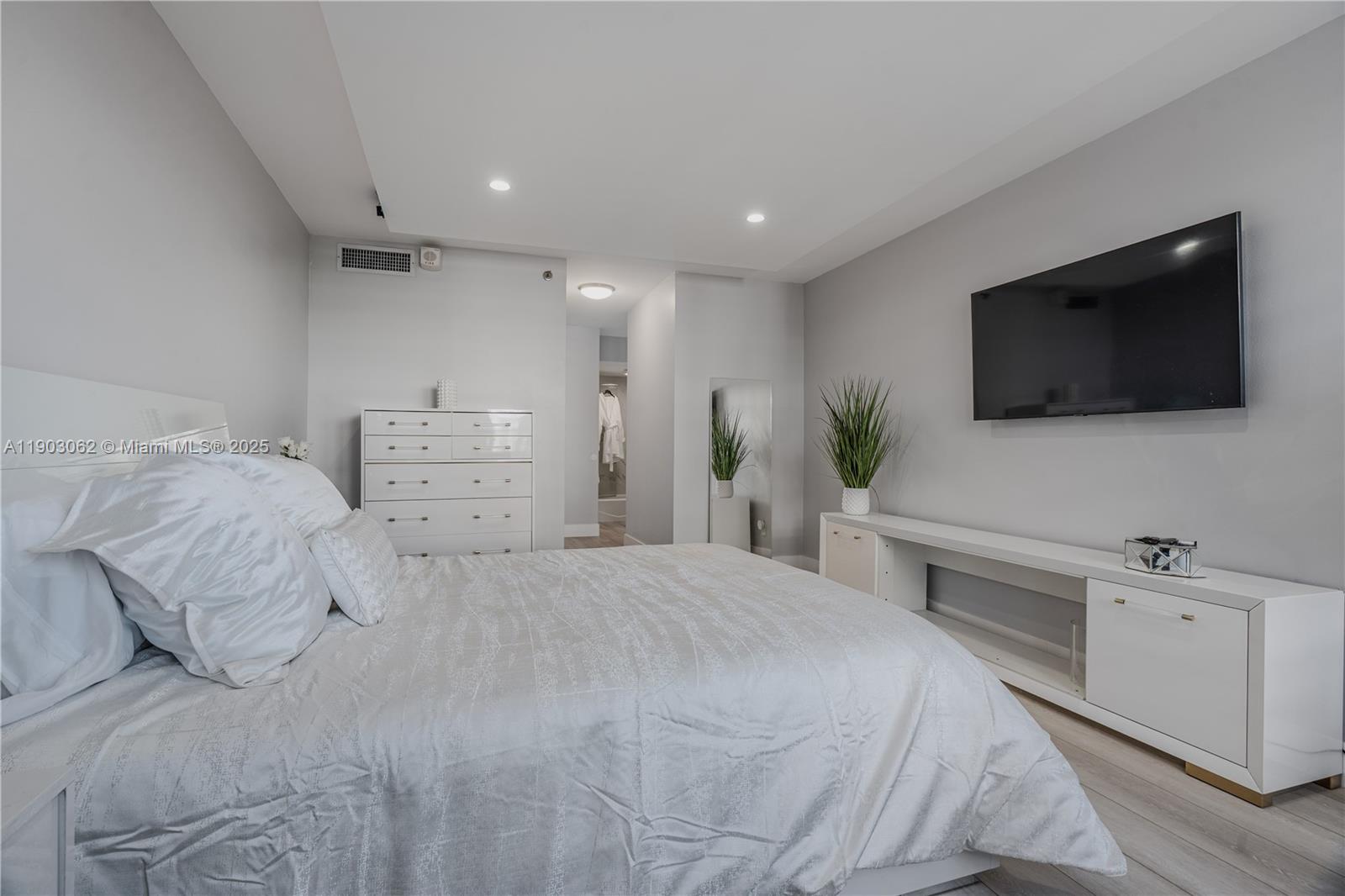 100 Lincoln Road, Unit 323 Miami Beach, FL 33139 - Photo 33 of 59 a bedroom with a bed and a flat screen tv