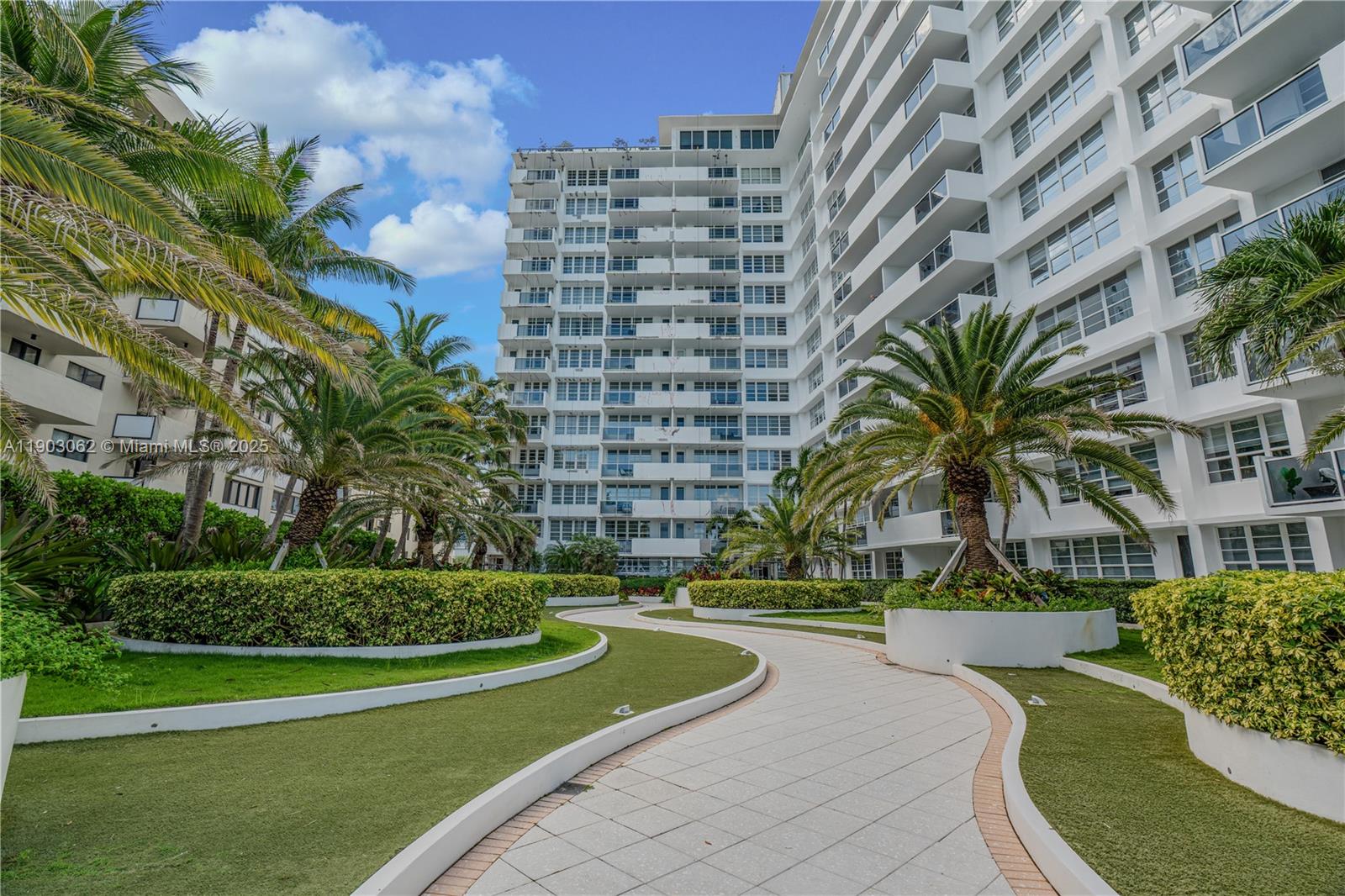100 Lincoln Road, Unit 323 Miami Beach, FL 33139 - Photo 37 of 59 a view of a tall white building next to a yard