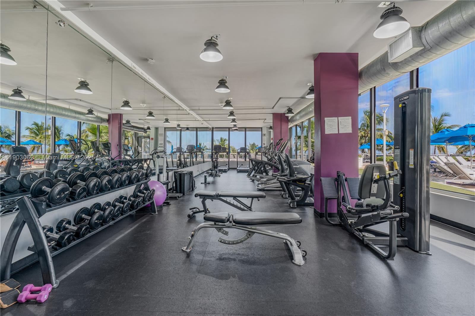 100 Lincoln Road, Unit 323 Miami Beach, FL 33139 - Photo 39 of 59 a living room with lots of gym equipment