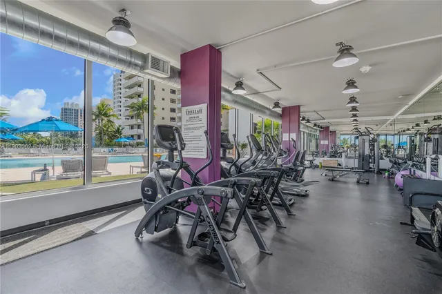 a view of kitchen with furniture and refrigerator