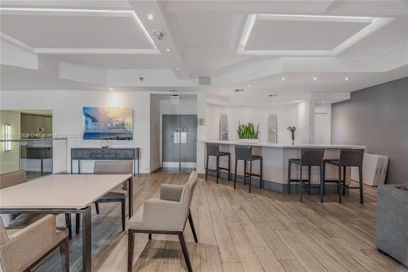 100 Lincoln Road, Unit 323 Miami Beach, FL 33139 - Photo 46 of 59 a view of a dining room with furniture and wooden floor