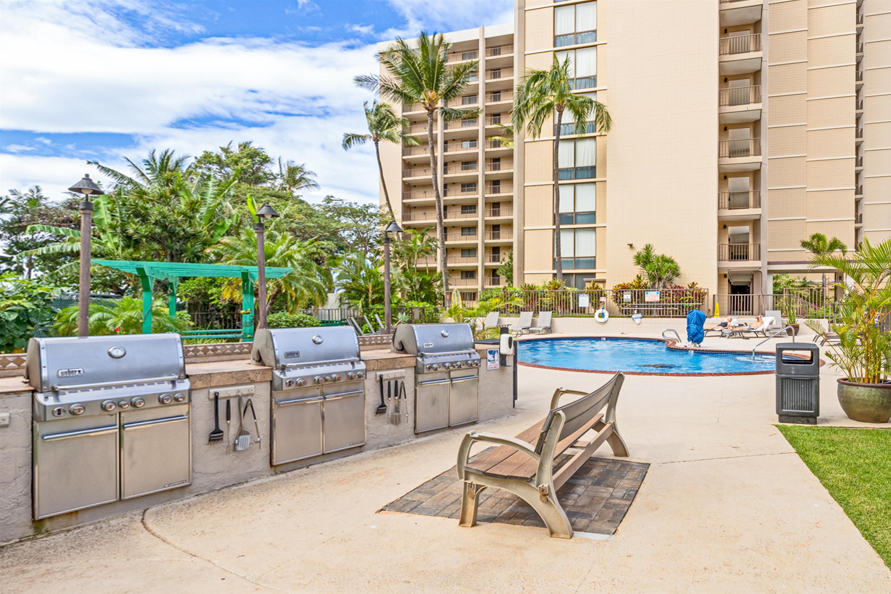 4327 Lower Honoapiilani Road, Unit 201B Lahaina, HI 96761 - Photo 24 of 26 a view of a patio with a table and chairs