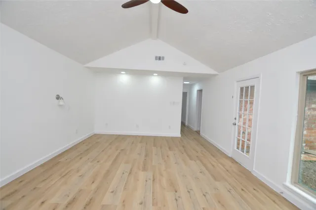 a view of an empty room with a window