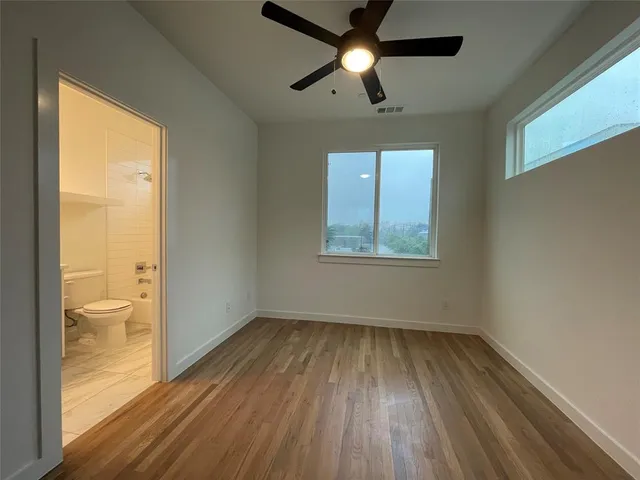 a bathroom with a toilet a sink and bathtub