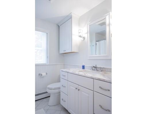 11 Pickwick Road Marblehead, MA 01945 - Photo 17 of 24 a bathroom with a toilet a sink a mirror and vanity