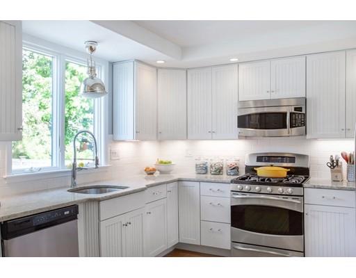 11 Pickwick Road Marblehead, MA 01945 - Photo 3 of 24 a kitchen with granite countertop a stove a sink and a microwave