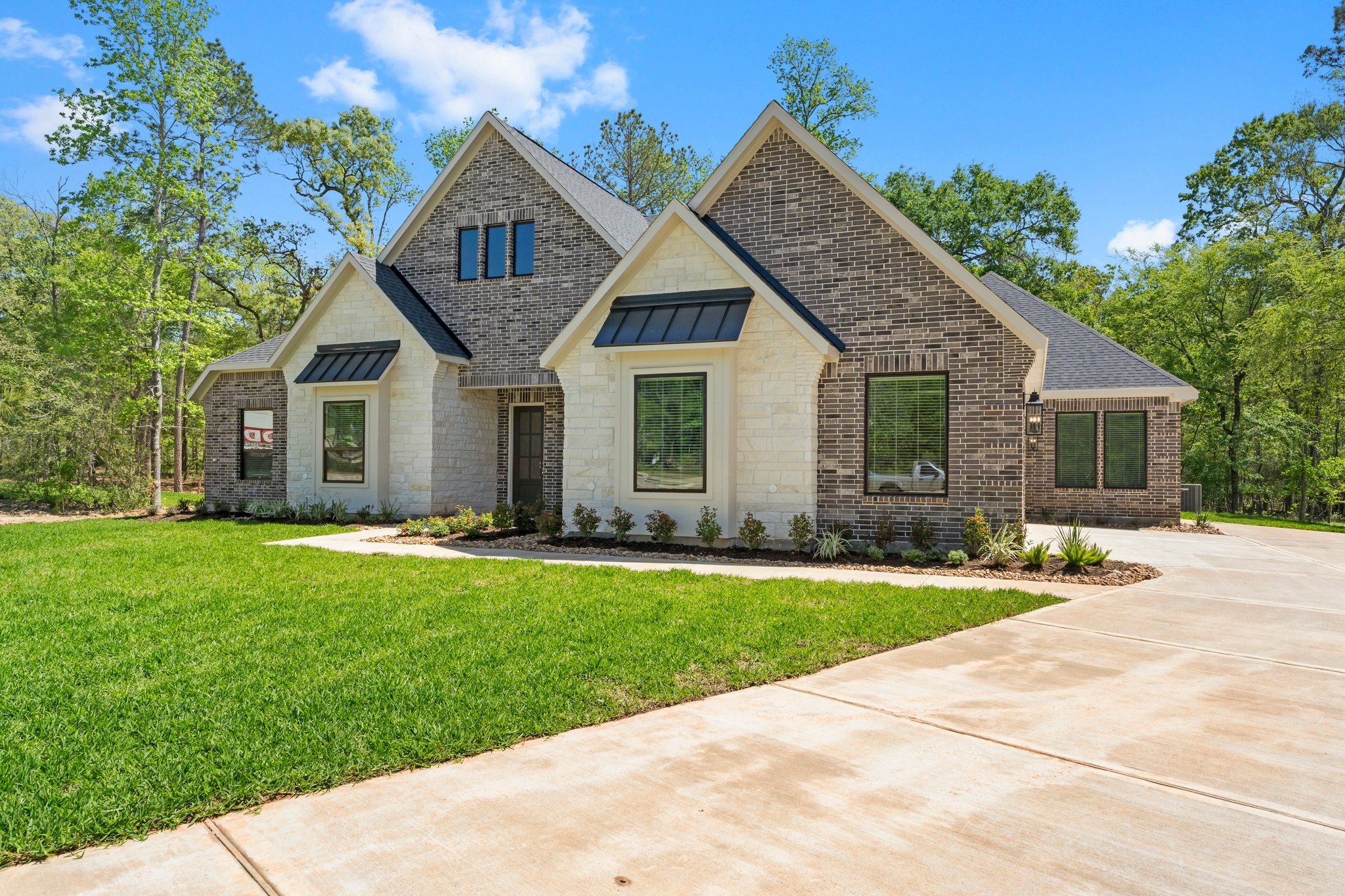 Lot 6 Homestead Hill Road New Waverly, TX 77358 - Photo 1 of 15 a front view of a house with a yard