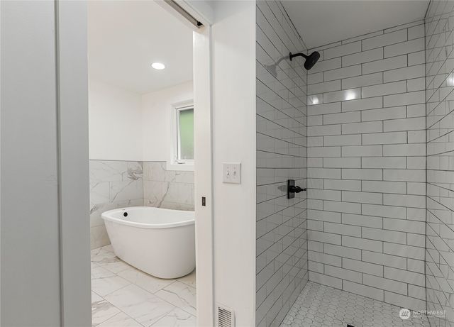a bathroom with a toilet and shower