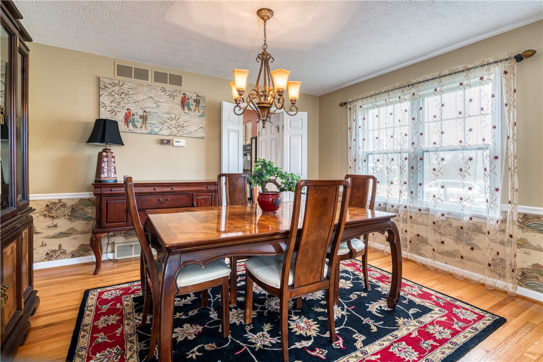 7 Bardney Circle Perinton, NY 14450 - Photo 14 of 38 Dining Room has gorgeous hardwoods and big windows