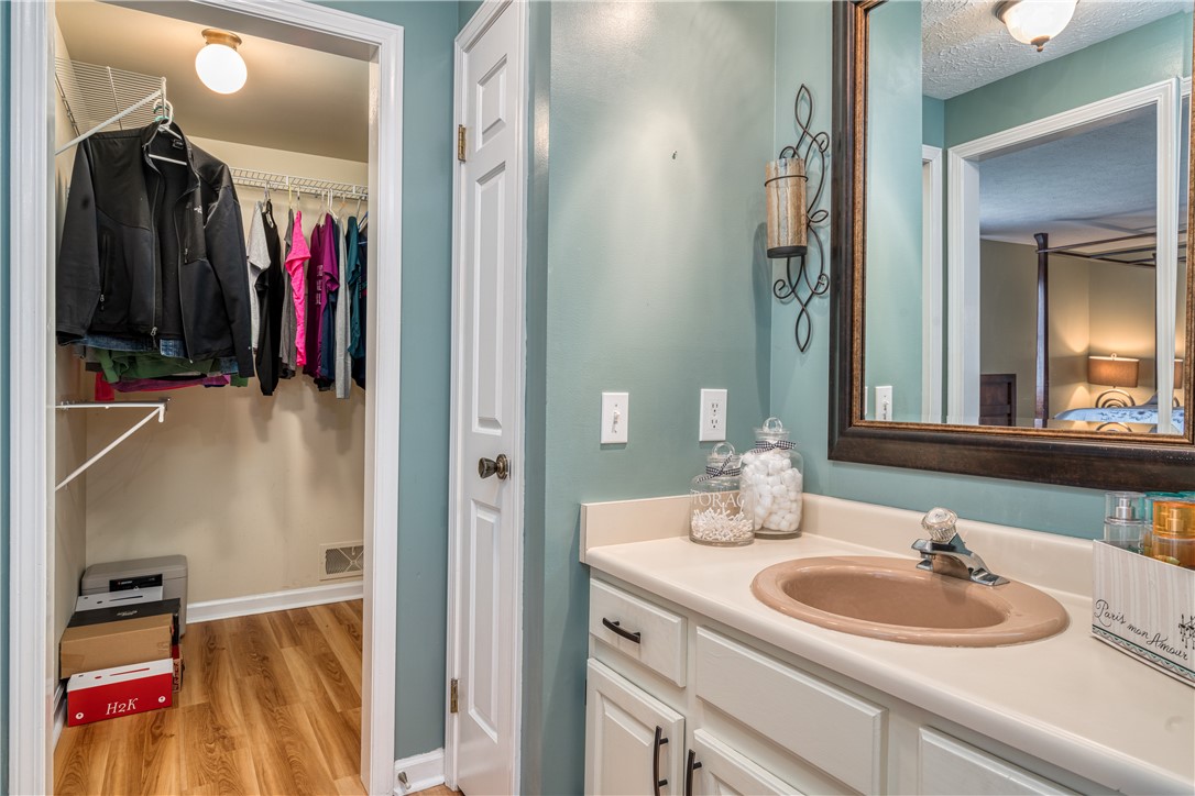 7 Bardney Circle Perinton, NY 14450 - Photo 24 of 38 Walk in Closet, linen closet and sink area outside