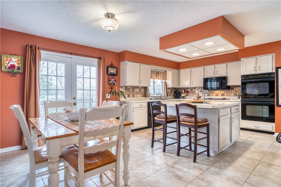 7 Bardney Circle Perinton, NY 14450 - Photo 8 of 38 HUGE kitchen with eat-in space. French Doors lead