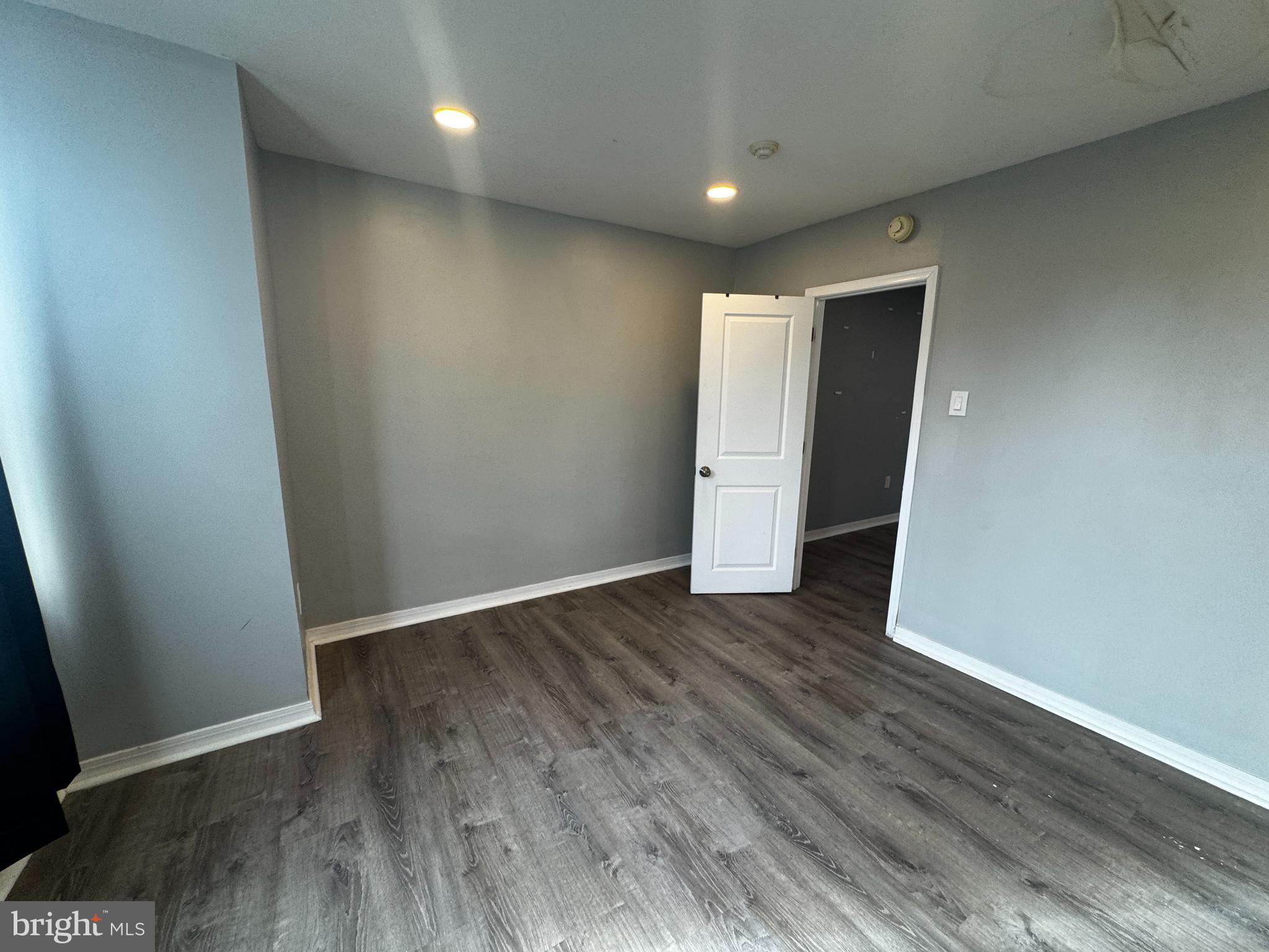 700 Lloyd Street Chester, PA 19013 - Photo 32 of 32 an empty room with wooden floor and closet