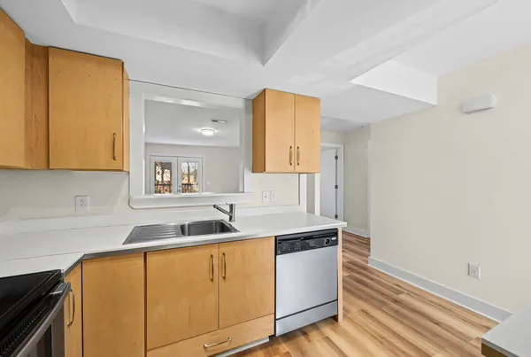 a kitchen with a sink and cabinets