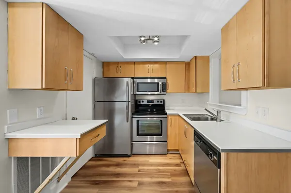 a kitchen with a sink and a refrigerator