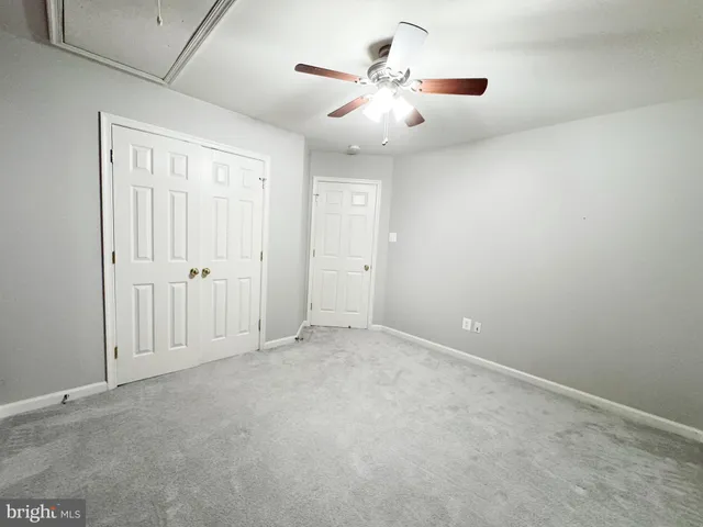 a bathroom with a sink double vanity granite tub and a mirror