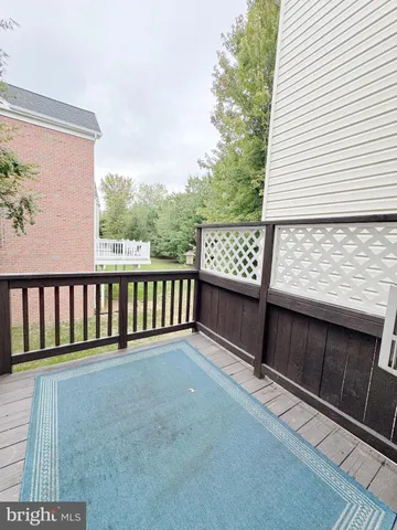 a view of a porch with wooden floor