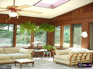 2 Raphael Road Hockessin, DE 19707 - Photo 6 of 6 a living room with furniture and large windows
